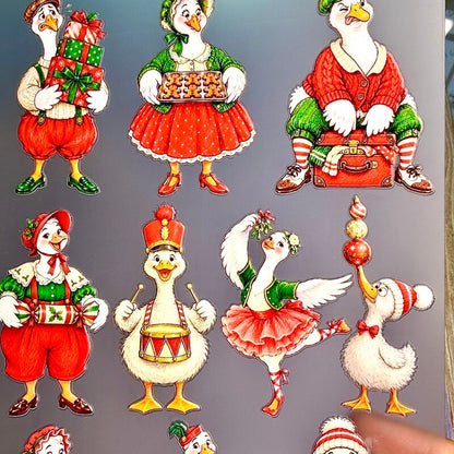 Christmasgoosestickerscarryinggifts_bakinggingerbreadcookies_dancingandbalancingornaments