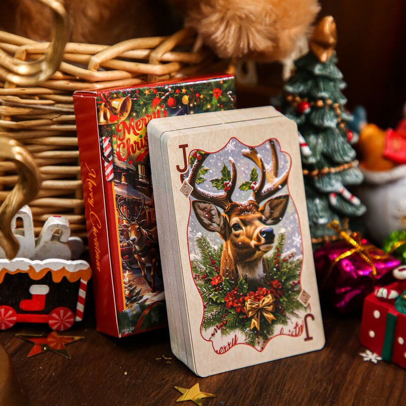 Christmasplayingcarddeckfeaturingareindeerjackbesideitsfestivebox