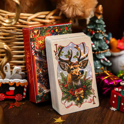 Christmasplayingcarddeckfeaturingareindeerjackbesideitsfestivebox