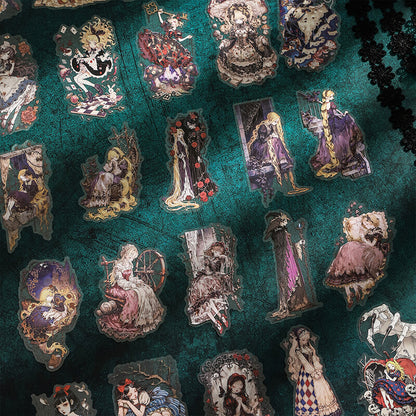 A close-up of a dark teal fabric surface covered with multiple die-cut stickers featuring vintage-style illustrated characters in elaborate dresses.