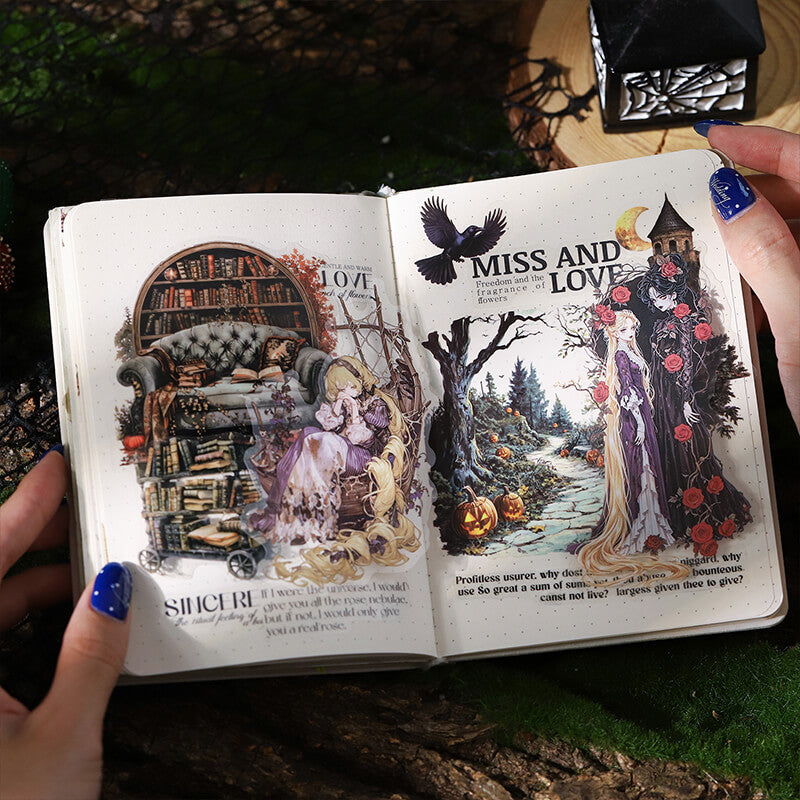 An open decorative book or journal spread shown in hands, featuring illustrated vintage-style scenes on both pages with text including 'MISS AND LOVE' and 'SUNRISE.' The setting appears outdoors on a mossy surface with a small black lantern nearby.