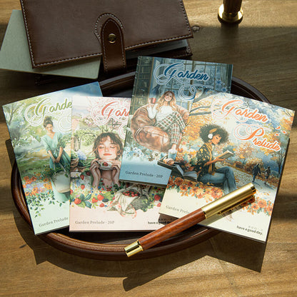 FourFourSeasonsGardenstickerbookdesignsdisplayedonawoodentraywithafountainpen