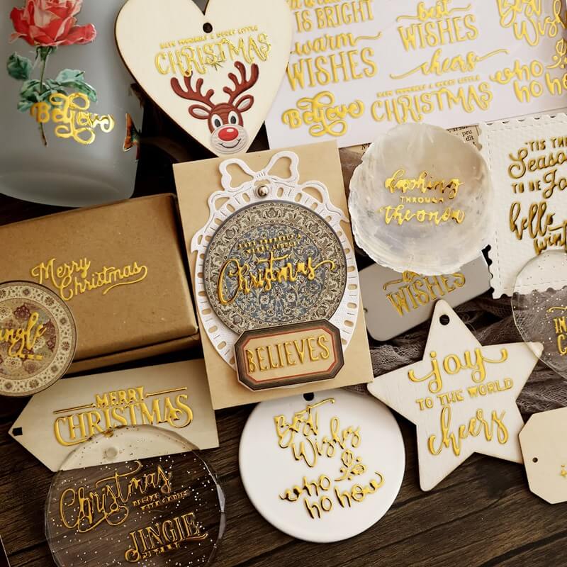 GoldChristmasUVtransferstickersappliedtoornaments_giftboxes_tagsandholidaycraftdecorations