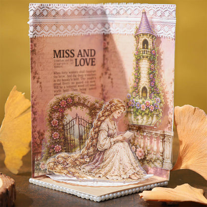 HandmadefairytaledisplayfeaturingaseatedRapunzelreadingbesideaflower-coveredtowerandgardengate