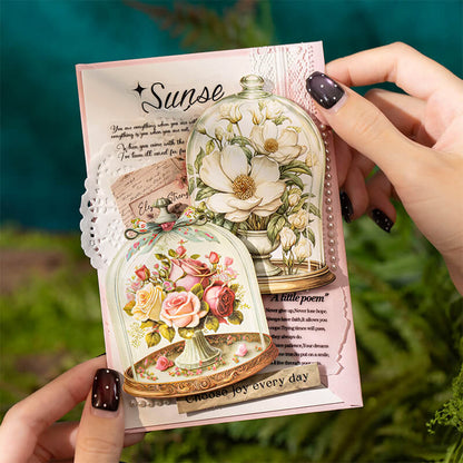 Handmadescrapbookcarddecoratedwithvintagefloralbottleandglassclochestickers