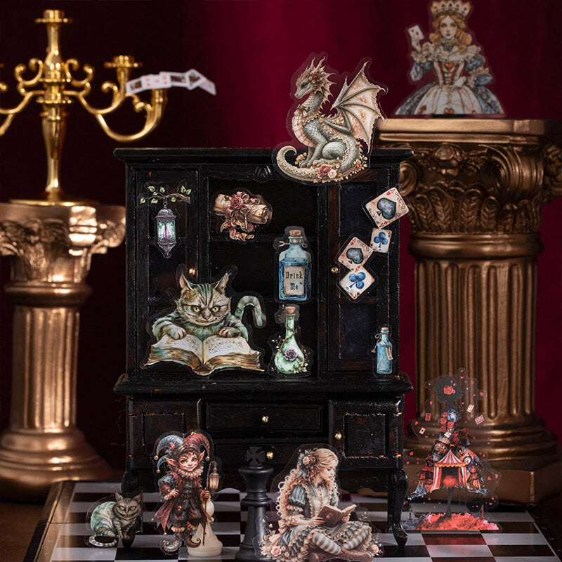 Miniature_black_cabinet_decorated_with_fantasy_stickers_of_a_dragon_reading_cat_potion_bottles_playing_cards_and_Alice