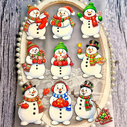 NinevintageChristmassnowmanstickerswithcolorfulscarvesandhats_holdinggifts_cocoa_abell_andornaments_displayedonadecorativetray